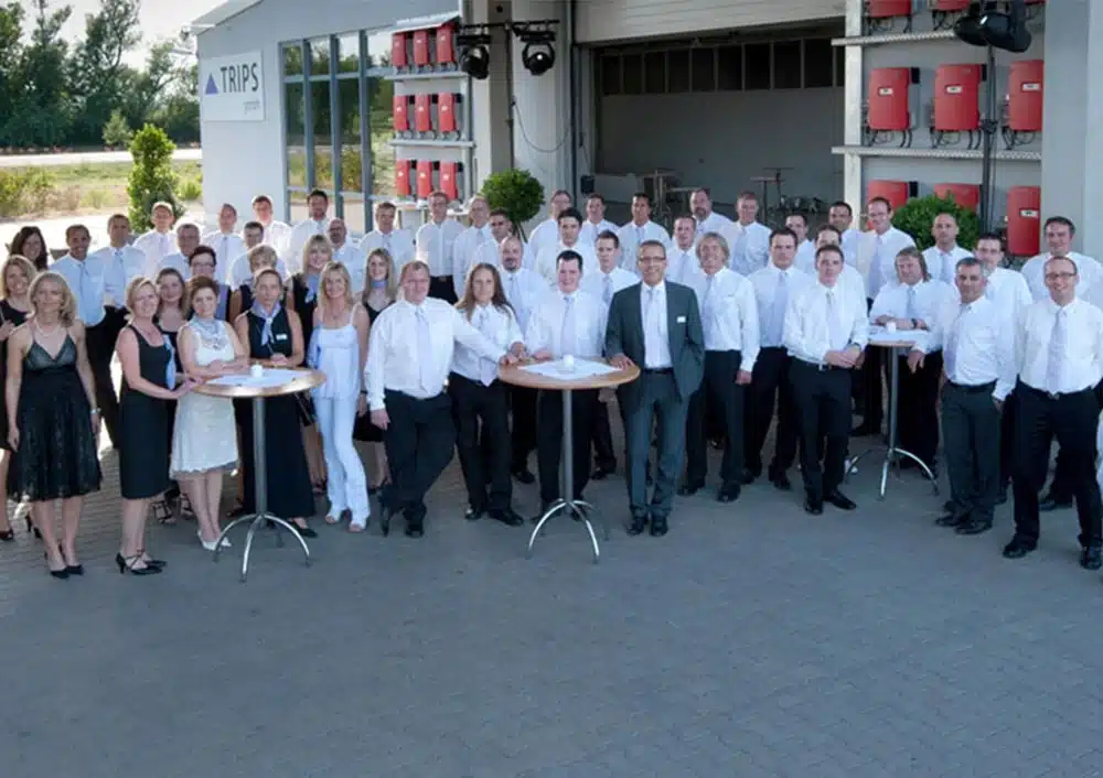 TRIPS-Belegschaft bei Feier in eleganter Kleidung | TRIPS group